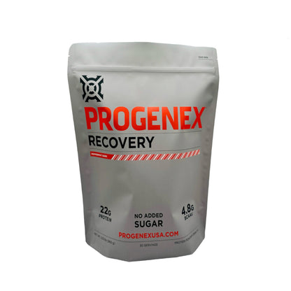 A package of PROGENEX Recovery with red and white branding, featuring text that reads '22g Protein' and 'No added Sugar'.