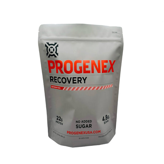 A package of PROGENEX Recovery with red and white branding, featuring text that reads '22g Protein' and 'No added Sugar'.